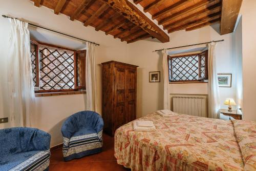 Ένα ή περισσότερα κρεβάτια σε δωμάτιο στο Borgo Villa a Sesta