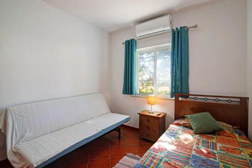 Ένα ή περισσότερα κρεβάτια σε δωμάτιο στο Villa Isabel
