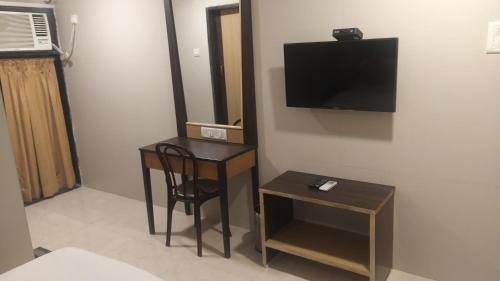 TV a/nebo společenská místnost v ubytování Hotel Palm Star