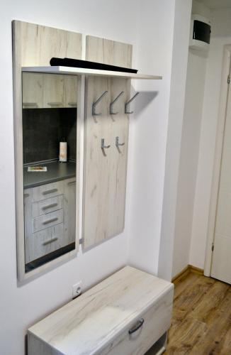 a kitchen with white cabinets and a counter at Apartmani Lorić in Višegrad