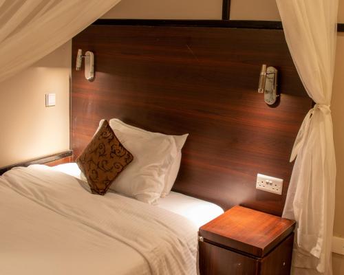 Postel nebo postele na pokoji v ubytování D2W Residency Suites