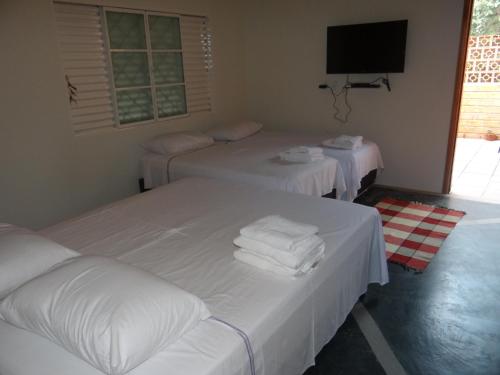 A bed or beds in a room at Eco Pousada Sinimbu