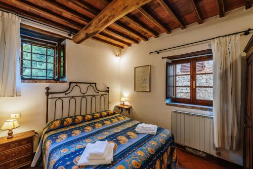Ένα ή περισσότερα κρεβάτια σε δωμάτιο στο Borgo Villa a Sesta