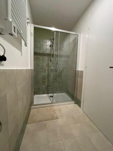 a shower with a glass door in a bathroom at L'Armonia in Gaeta