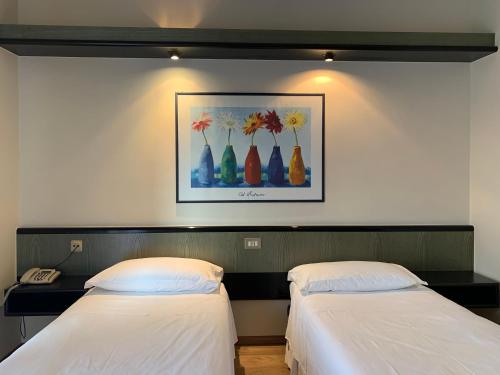 Hotel Parigi 2 & Spaにあるベッド
