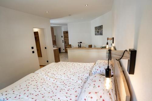 a bedroom with a bed in a room at Haus Kogelleiten in Ramsau