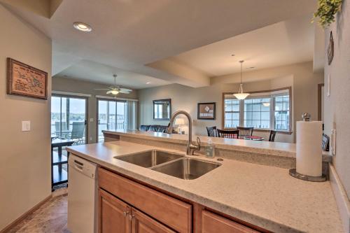 a kitchen with a sink and a counter top at Lake Ozark Condo with Boat Slip and Pool Access! in Lake Ozark