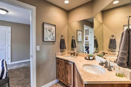 a bathroom with two sinks and a large mirror at Cottonwood Heights House with Deck and Gas Grill! in Cottonwood Heights