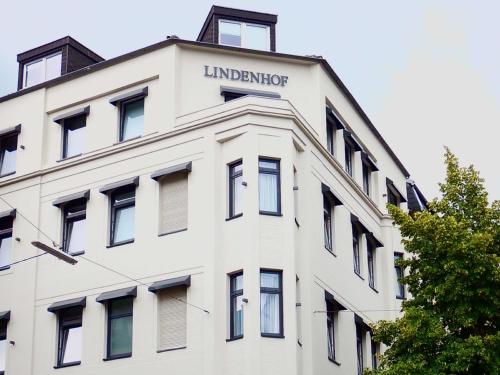 a large building with a large window on top at Hotel Lindenhof in Düsseldorf