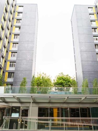 a building with a balcony in front of a building at Chapter Lewisham in London in London
