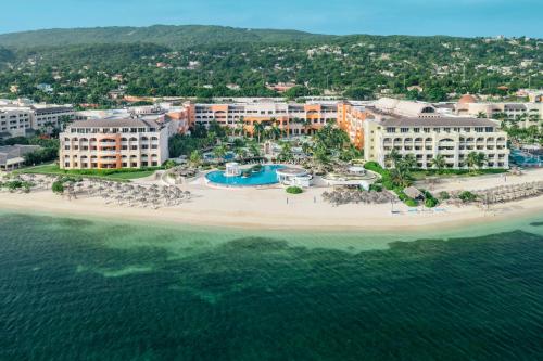 an aerial view of a resort on a beach at Iberostar Selection Rose Hall Suites in Montego Bay