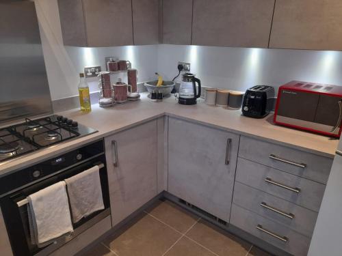 A kitchen or kitchenette at Beautiful Double Bedroom- In a modern 2 bed shared house