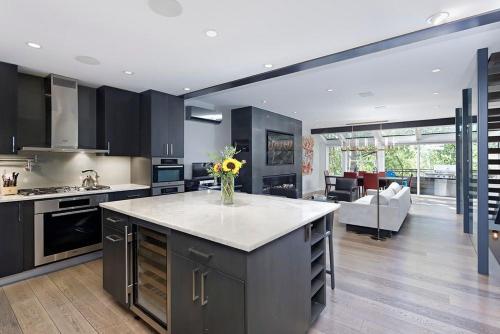 a kitchen with a kitchen island with a vase of flowers at New Listing West End Jewel - Steps to bus to 4 ski areas 4860 in Aspen