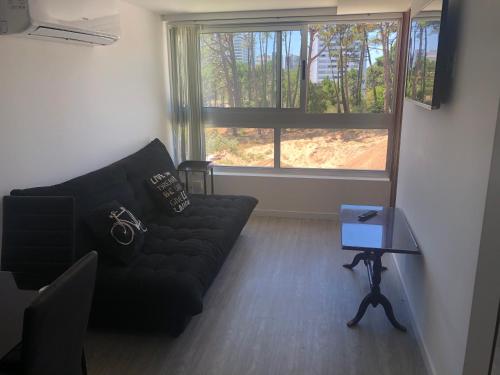 Χώρος καθιστικού στο Punta de Este:open Pool and índole Pool,gym,Netflix,aire,garage