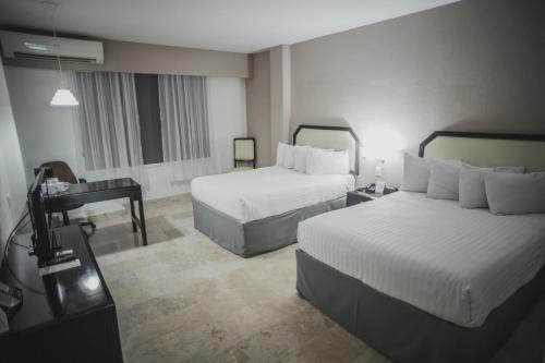 Days Inn by Wyndham Tuxtepecにあるベッド