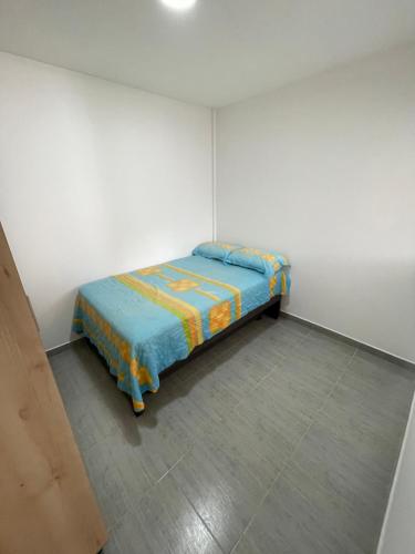 Ένα ή περισσότερα κρεβάτια σε δωμάτιο στο apartamento Hope Guatape