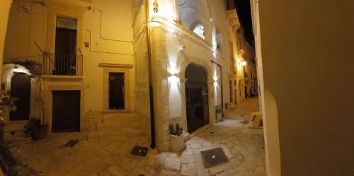 an empty alley in a building at night at Accogliente Dimora in Putignano