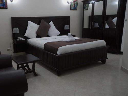 Katil atau katil-katil dalam bilik di La Pepiniere Hotel