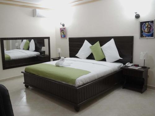 Katil atau katil-katil dalam bilik di La Pepiniere Hotel