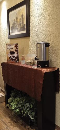 a counter top with a pot on top of it at Hotel Teresita in Puebla