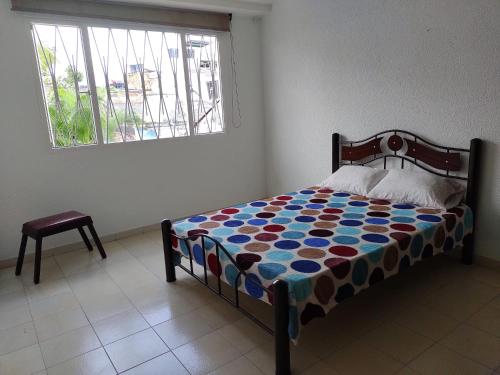 Ein Bett oder Betten in einem Zimmer der Unterkunft Agradable casa vacacional cerca al centro de Anapoima