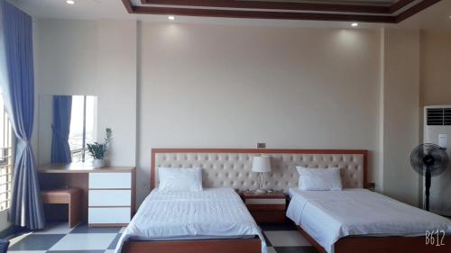 Postel nebo postele na pokoji v ubytování Vu Gia Khanh Apartment