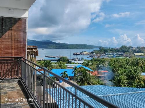 a view of the water from the balcony of a building at Island Cliff in Port Blair