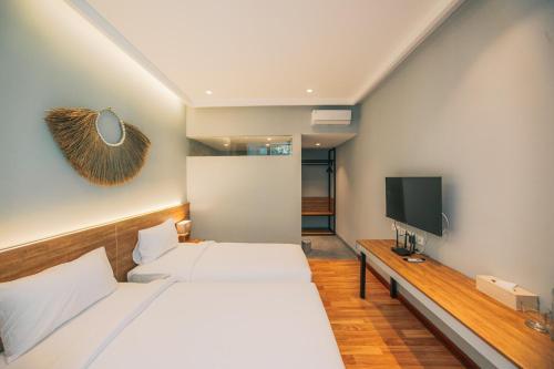 Una cama o camas en una habitación de Bestah Coliving