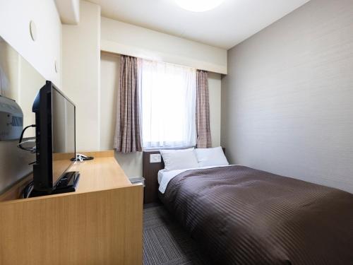 TV a/nebo společenská místnost v ubytování Hotel Wing International Izumi