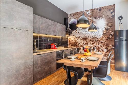 a kitchen with a wooden table and chairs at Cuckoo's Nest - Kalamata City Centre Luxury in Kalamata