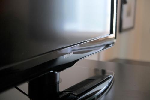 a television sitting on top of a table at AmericInn by Wyndham West Bend in West Bend