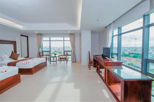 Postel nebo postele na pokoji v ubytování Ban Ban Hotel