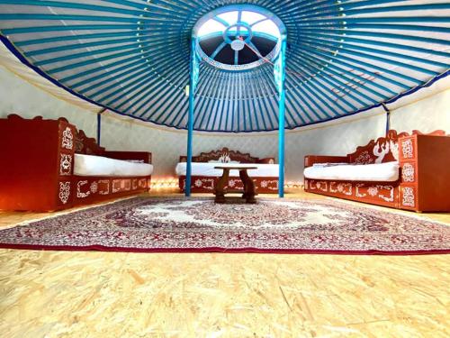 a room with a tent with a table in it at Mongolian Yurt Camp in Český Šternberk