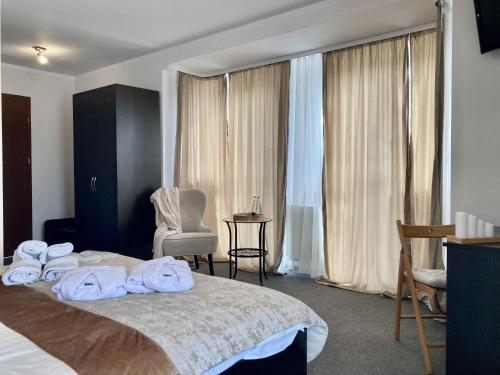 a hotel room with a bed with towels on it at Hotel Solec in Solec