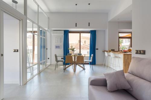a living room with a couch and a table at La Nogalera Torremolinos Centro in Torremolinos