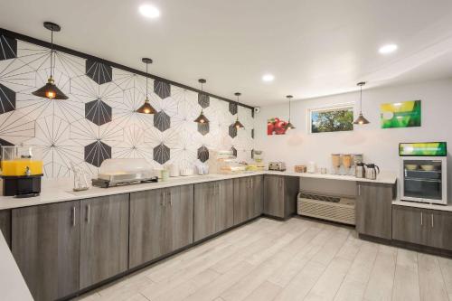 a large kitchen with a counter top with at Quality Inn Bradenton - Sarasota North in Bradenton