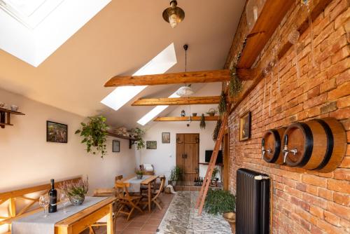 an attic conversion of a house with a brick wall at Penzion Tašner in Litomyšl
