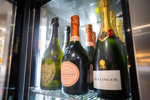 a refrigerator filled with lots of bottles of wine at The Crown Hotel Bawtry-Doncaster in Doncaster