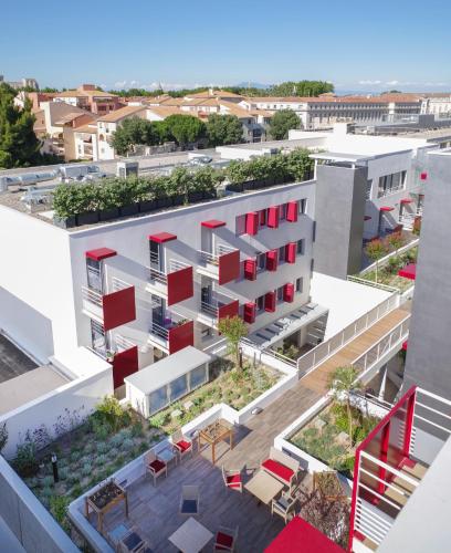 an aerial view of a building with red windows at Résidence d'Avignon in Avignon