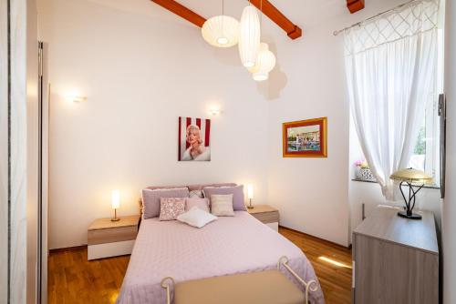 Ένα ή περισσότερα κρεβάτια σε δωμάτιο στο Apartments Villa Ida