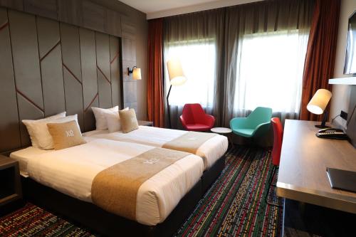 Een bed of bedden in een kamer bij XO Hotels Couture