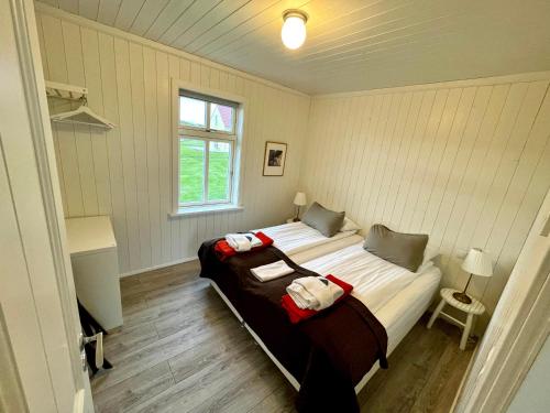 a bedroom with a large bed in a room at Hótel Lækur in Hella
