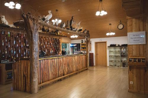 a room with a bar with a wooden wall at Hótel Dyrhólaey in Vík
