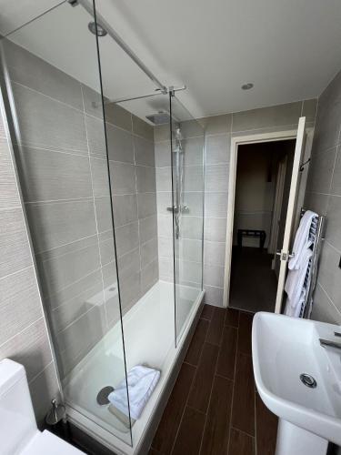 a bathroom with a shower and a sink at Walworth Castle Hotel, BW Signature Collection in Darlington