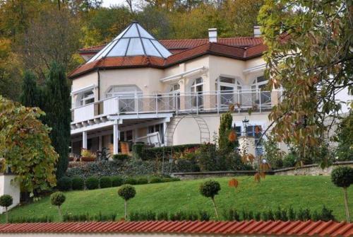 a large white house with a red roof at Böhler's Landgasthaus in Bad Driburg