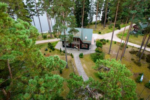 an aerial view of a house in the woods at LVM tūrisma un atpūtas centrs "Spāre" in Spāre