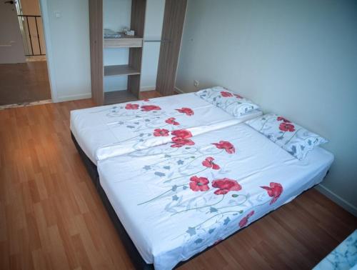 Katil atau katil-katil dalam bilik di Vakantiewoning Renee
