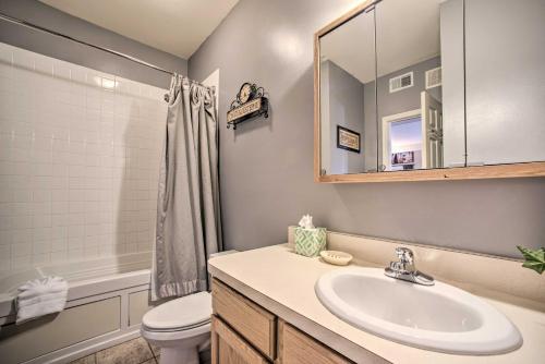 a bathroom with a sink and a toilet and a mirror at Hunter Mountain Ski Retreat - Steps to Lift! in Hunter