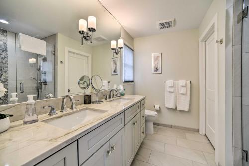 a bathroom with a large sink and a toilet at Fenton Home with Patio and All Sports Lake Access in Fenton