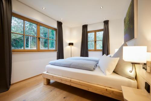 Zugspitzerei - Premium Chalet Ferienwohnungenにあるベッド